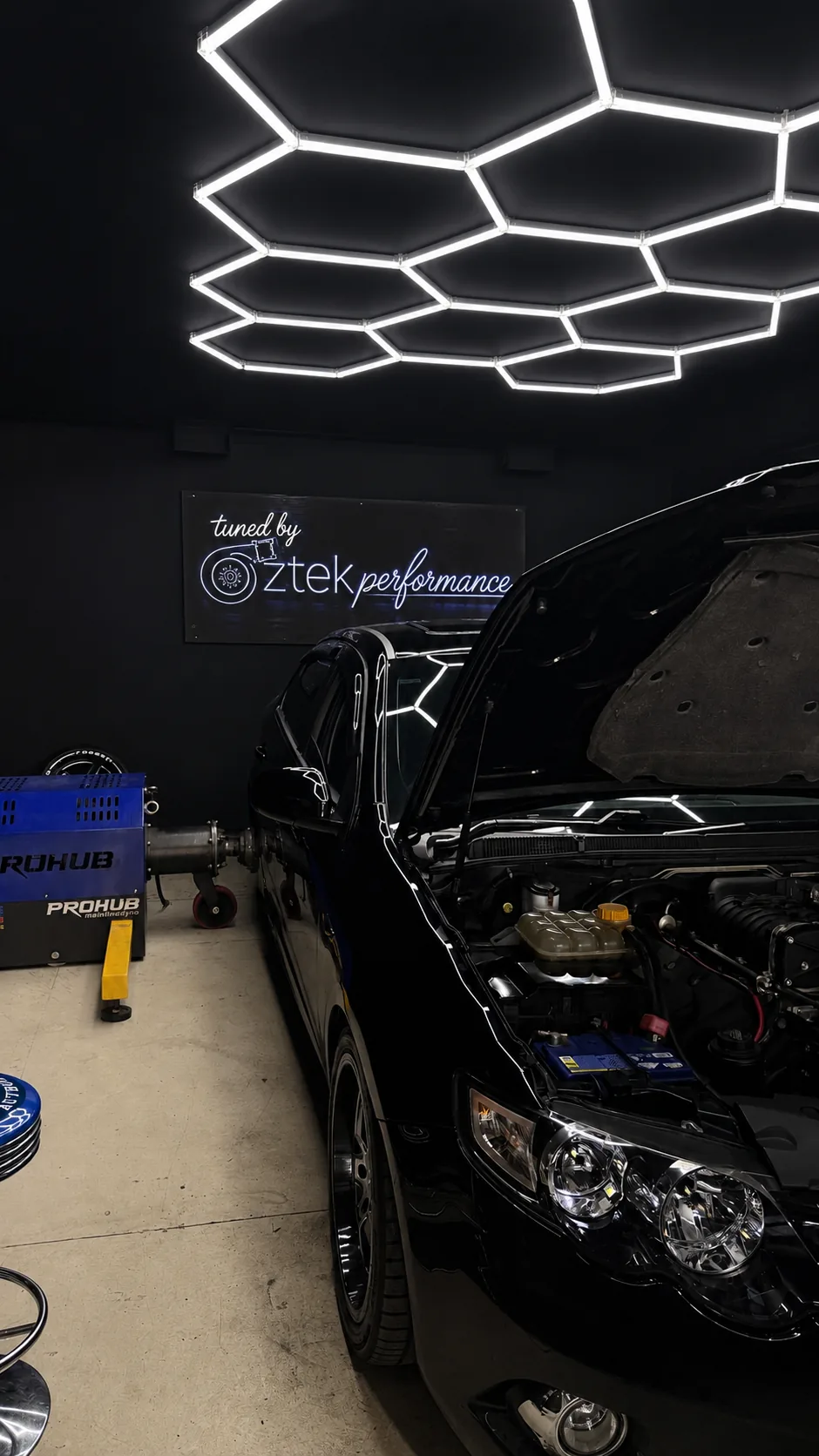Black performance car in OZTEK dyno room