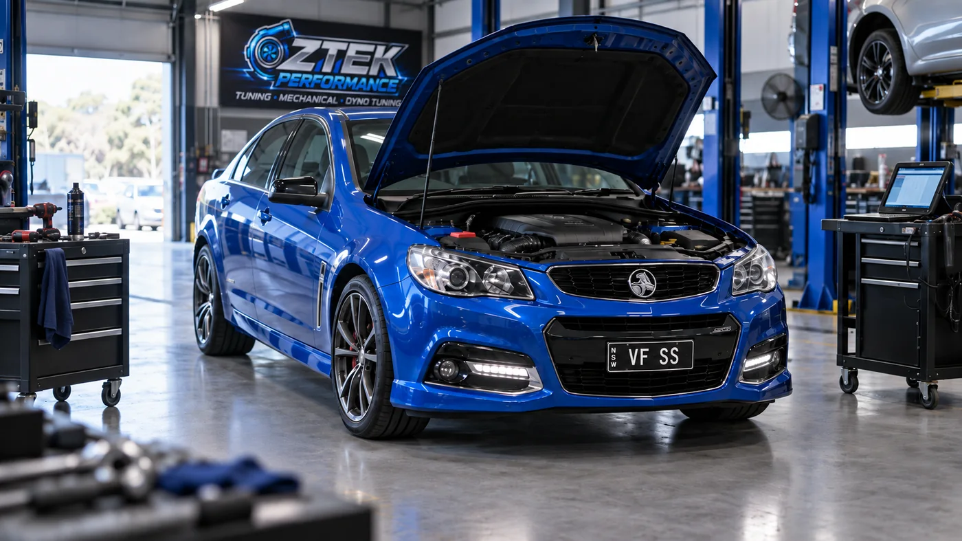 Blue VF SS Commodore with bonnet open in OZTEK workshop
